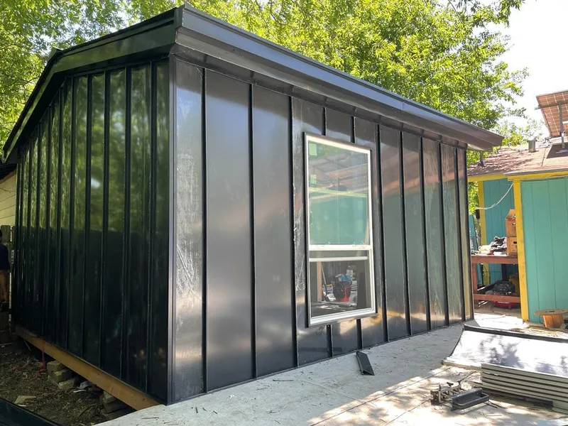 Black standing seam metal wall panels for Roof Inspection in Wilton