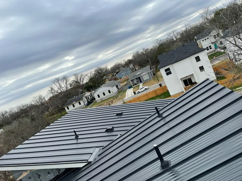 Standing seam metal roof panels with vents for Skylight Repair in Wilton